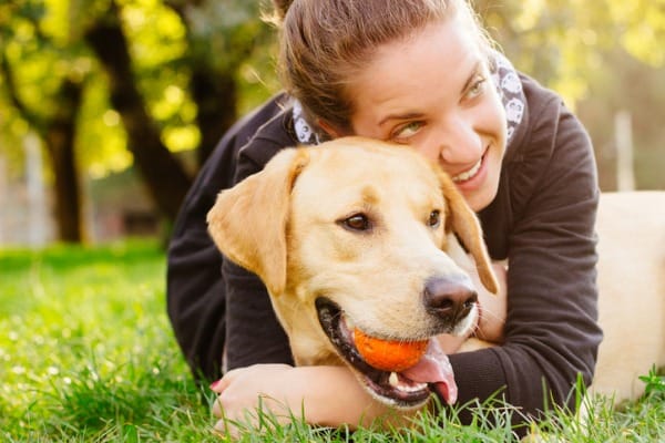 Embracing a dog